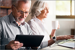 Elderly couple together at the kitchen